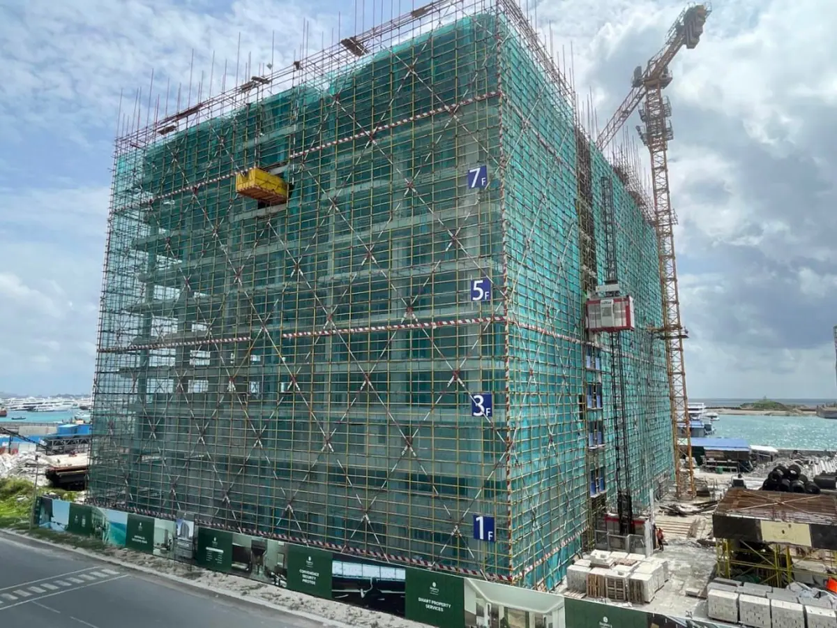 The tower in scaffolding as the 11th-floor slab was completed in July 2025. Photo: Bayfancy